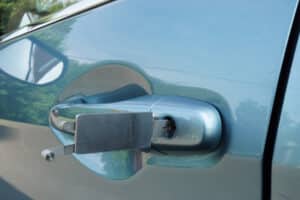 A car door handle that has been unlocked.